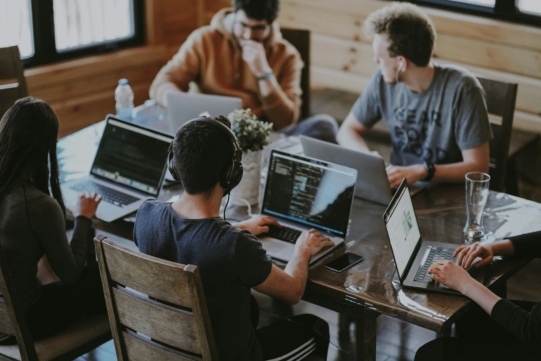 People discussing digital work around a table